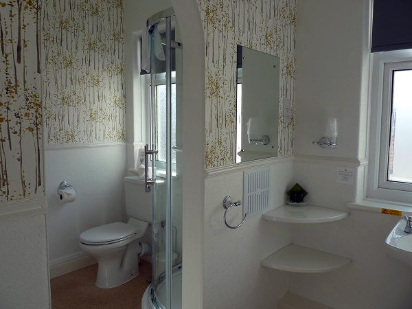 En-suite with shower, bath, basin, WC and heated towel radiator