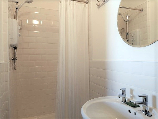 En-suite with shower, basin and WC